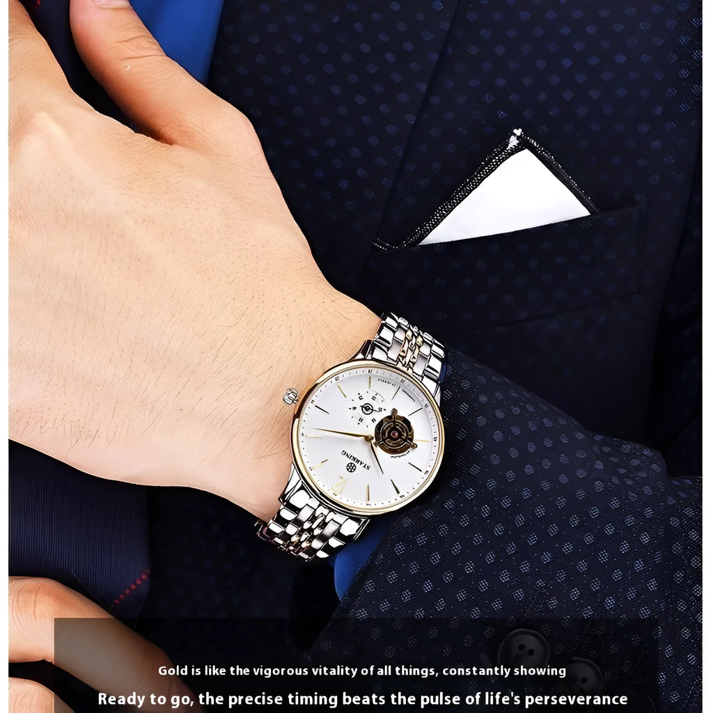 Automatic mechanical men's watch with brown leather strap and stainless steel case showing hollow three-needle dial design