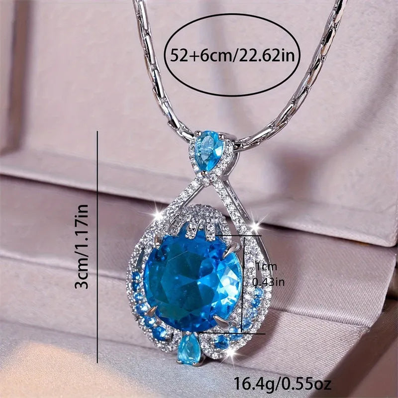 Blue geometric pendant necklace with fireworks cut crystal gems on water wave chain