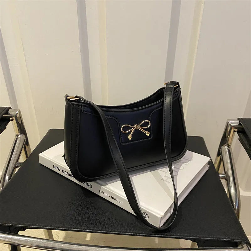 PU leather shoulder bag with bow detail in horizontal square shape showing rose red colour option