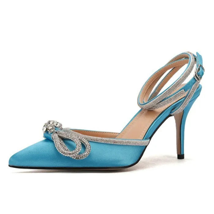 Women's black stiletto heel sandals with a silk bandage back strap and buckle closure.
