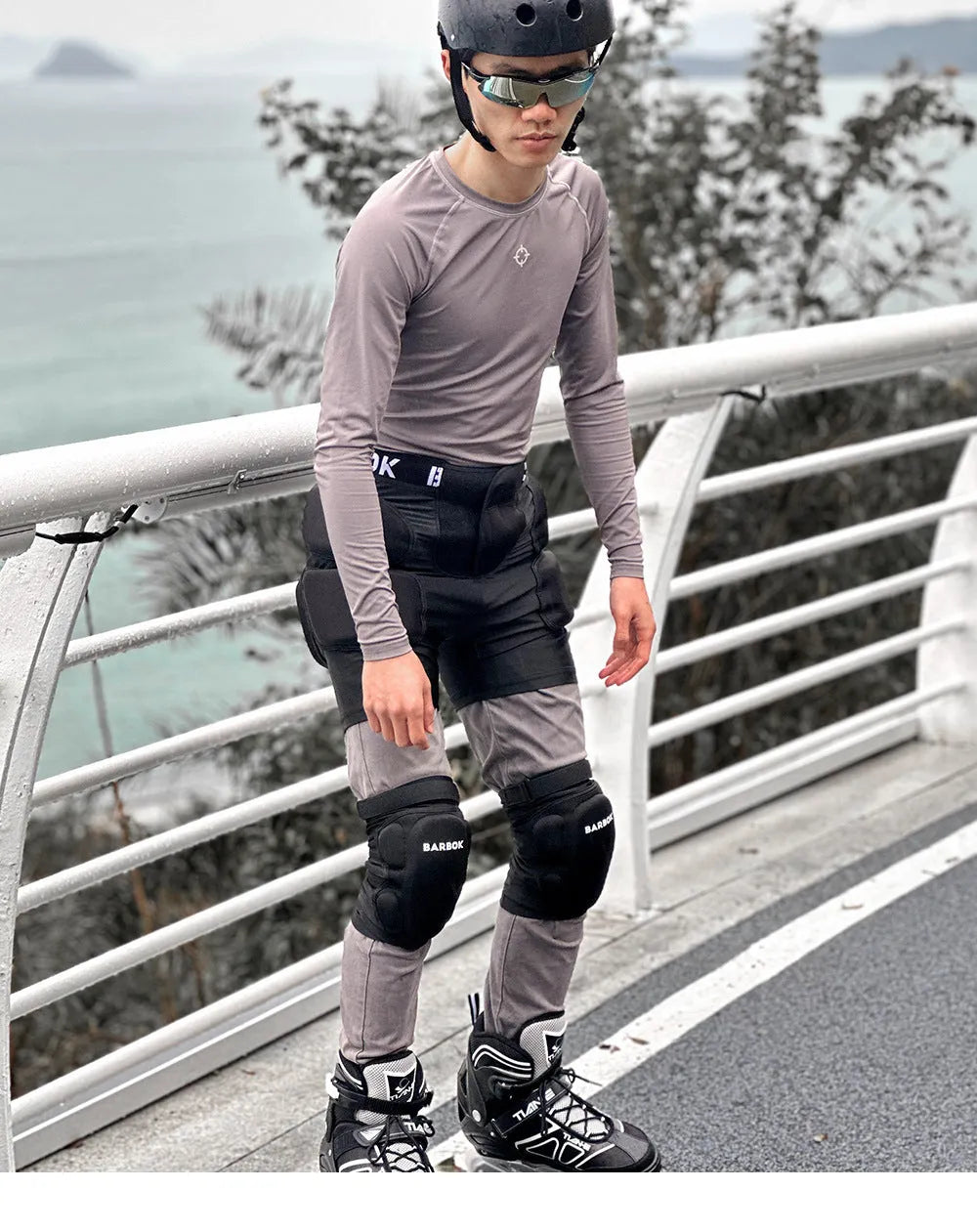 Black sports hip protector with NBR foam padding on spandex base for skating and skiing safety