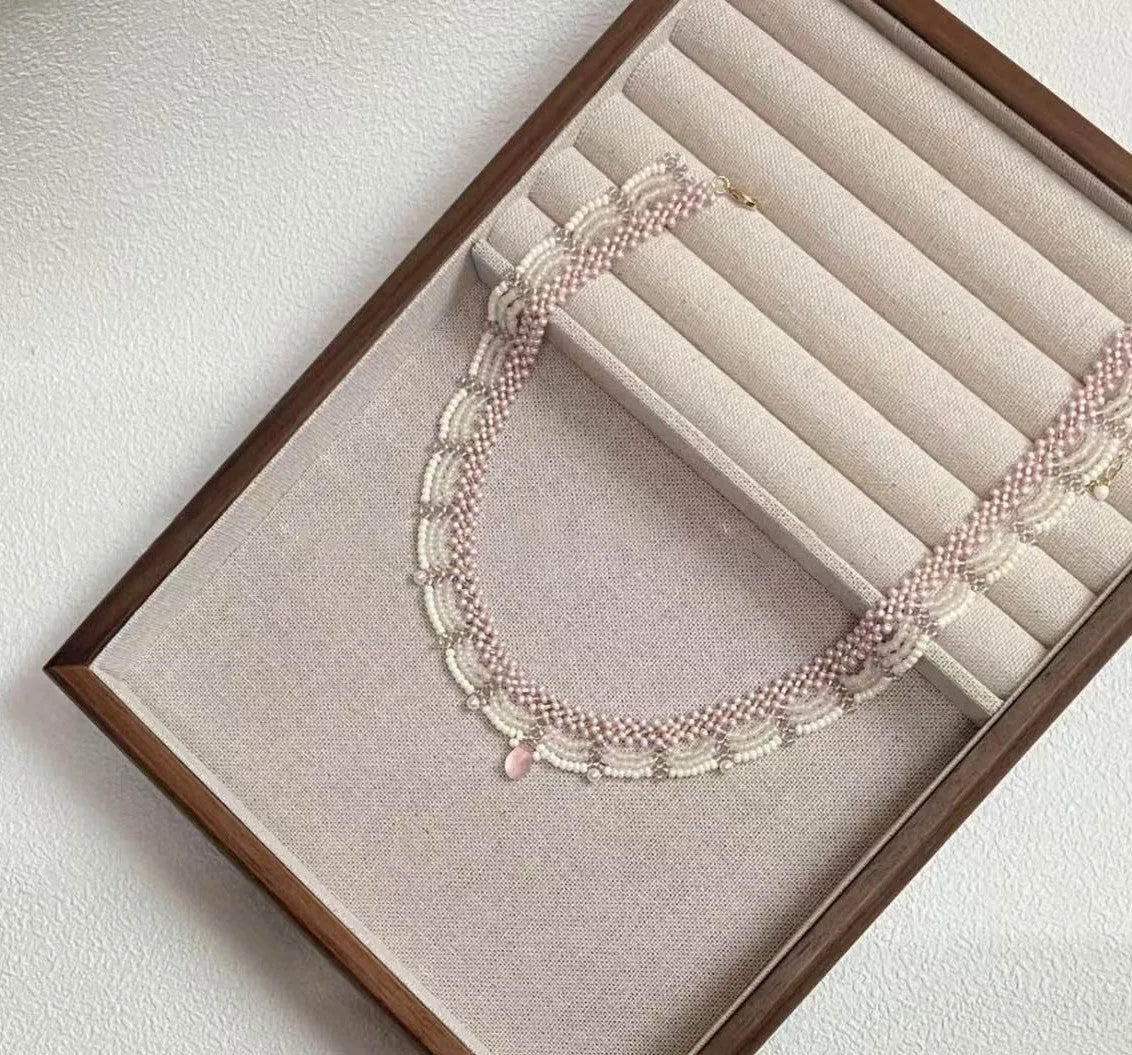 Hand-woven glass beaded wave necklace in pink with alloy pendant and matching bracelet
