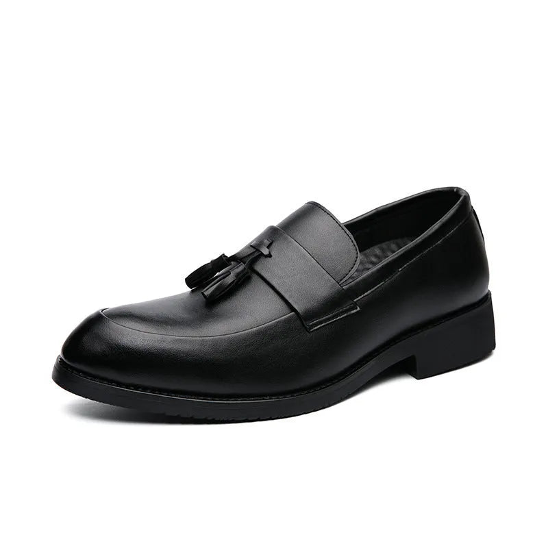 Men's black slip-on tassel loafers with low-top design and rubber sole for business casual wear