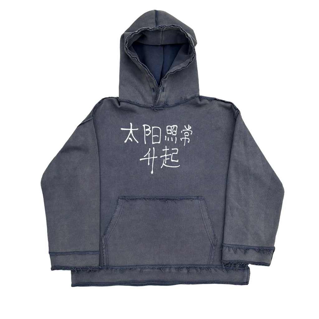 Dark blue hooded sweater with 'The Sun Also Rises' text printed on the back.