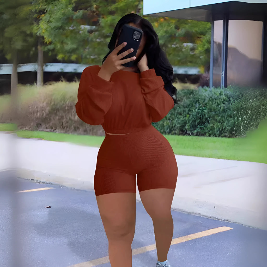 Women's solid colour off-the-shoulder long sleeve top and shorts two-piece set with sunken stripe pattern.