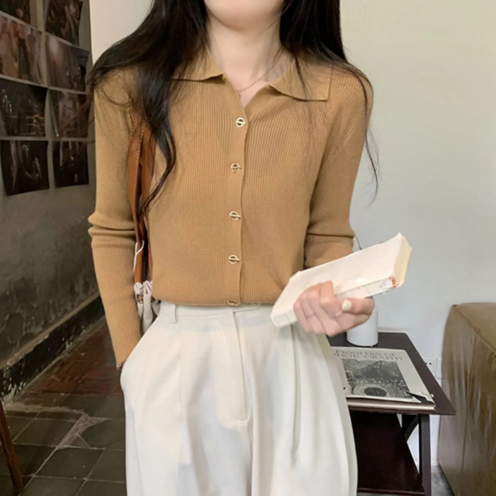 Gentle long-sleeved knitted cardigan in viscose fibre with loose fit design shown in beige colour