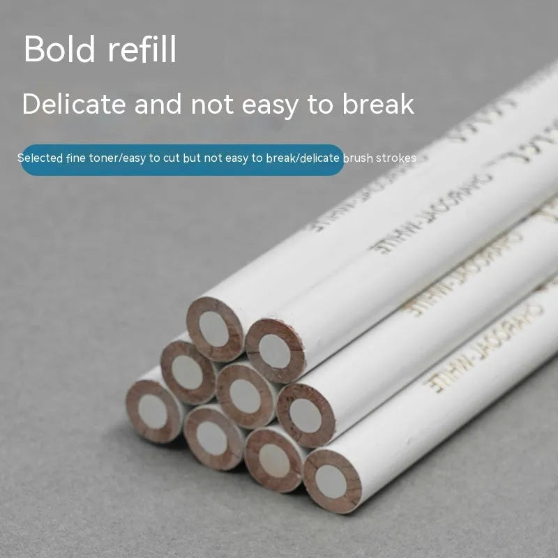 Three white charcoal sketching pencils with wooden casings for highlight work
