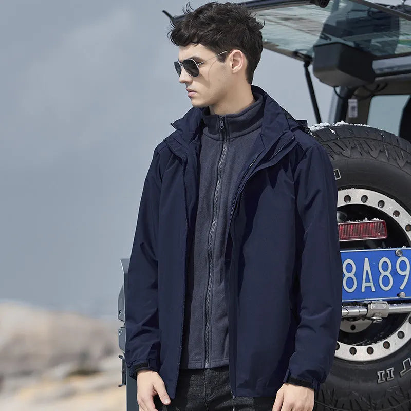 Man's black three-in-one removable waterproof mountaineering suit for hiking and skiing.