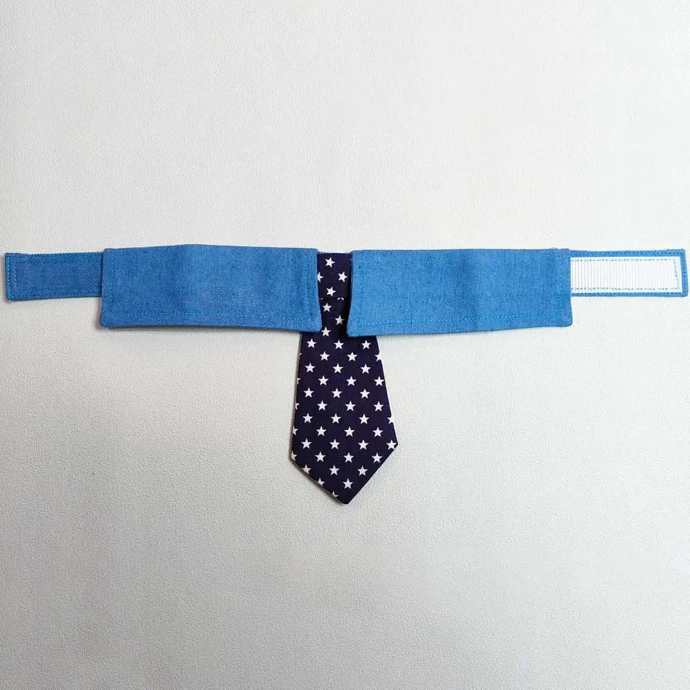 Denim pet collar with star pattern necktie attached, showing adjustable fastener tape and three size options