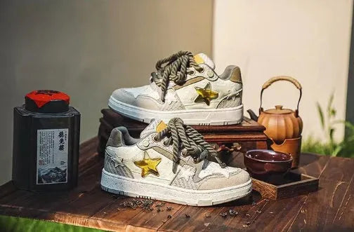 Green low top casual shoes with star pattern stitching and thick rubber soles