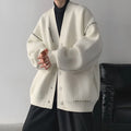 Women's loose black knitted cardigan coat with long sleeves