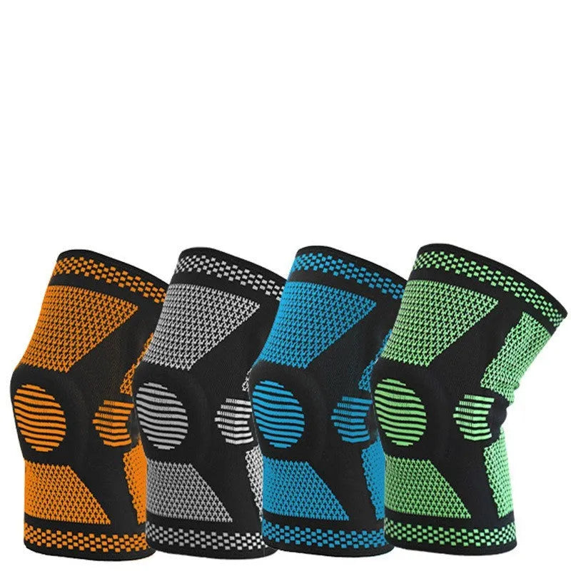 A green polyamide knee pad with a visible silicone spring and adjustable strap, laid flat.