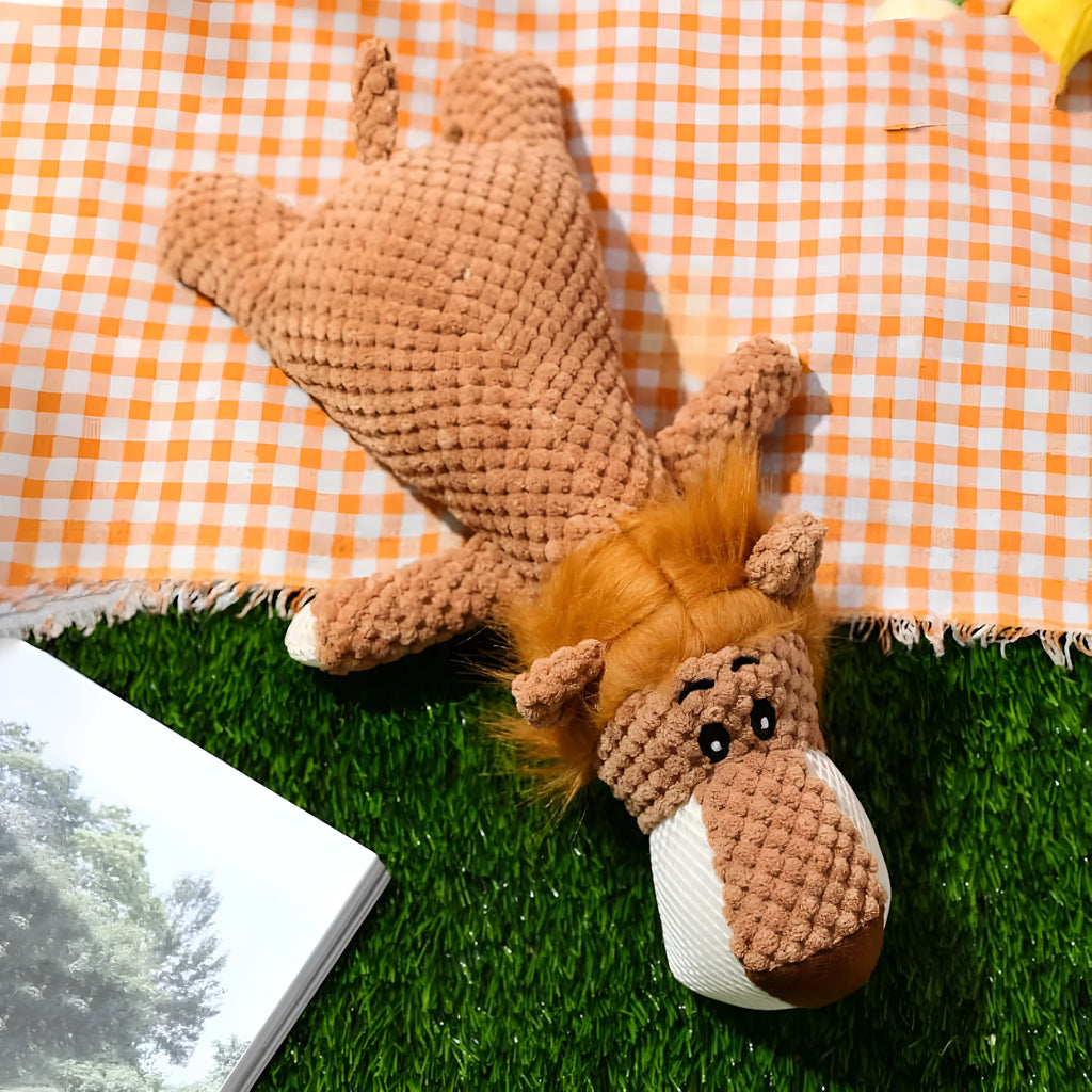 Green plush dog toy shaped like corn with textured kernel surface and squeaker inside