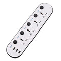Multi-switch USB power strip compatible with international plugs on a desk.