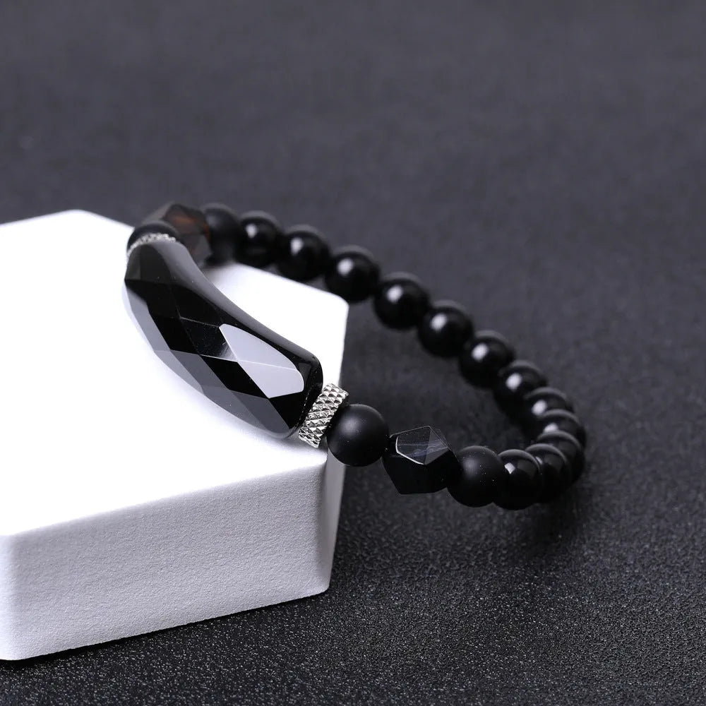 Handmade diamond-shaped cut black agate bracelet with geometric design and fan-shaped elements