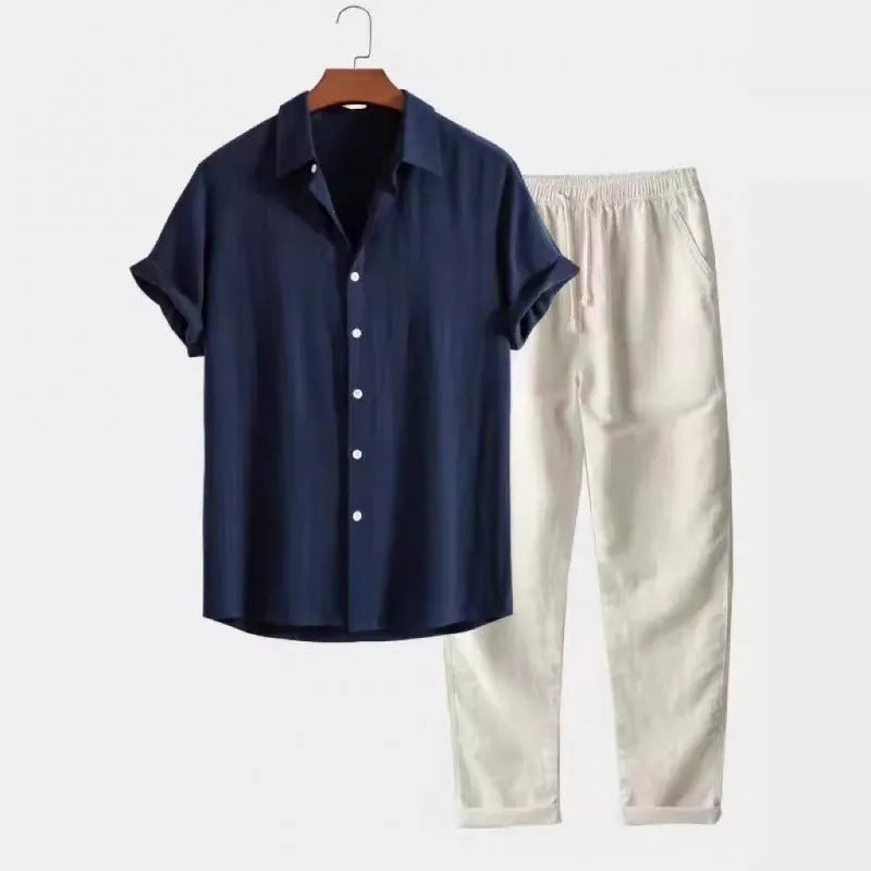 Man wearing a loose-fit linen-blend short sleeve shirt and matching casual trousers from a co-ord suit set.