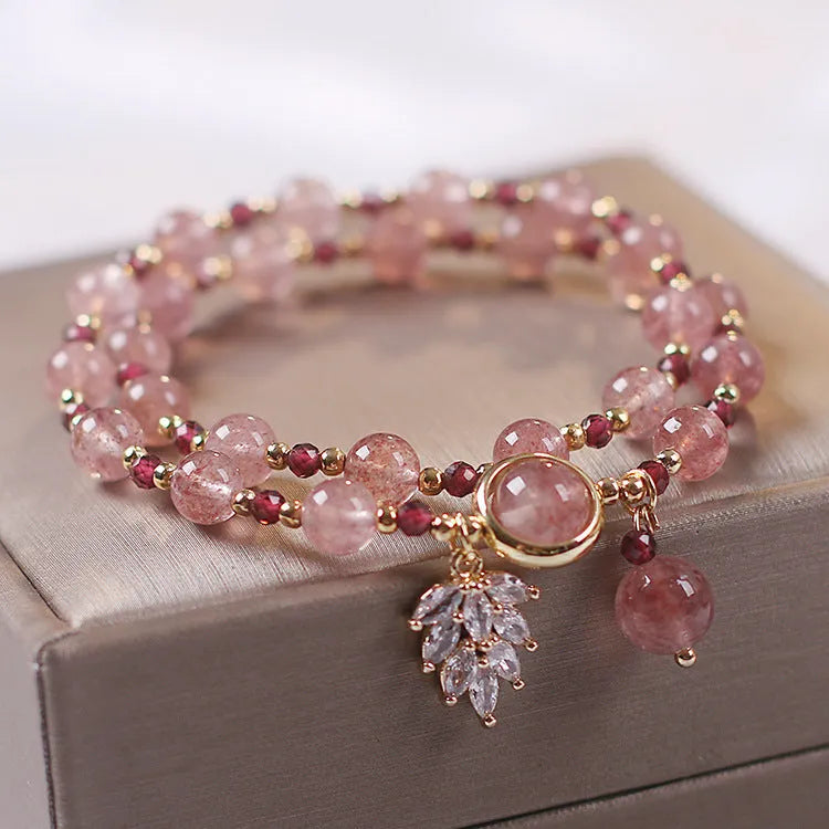 Women's double layer crystal bracelet with lucky cat charm and red cat's eye flowers design.