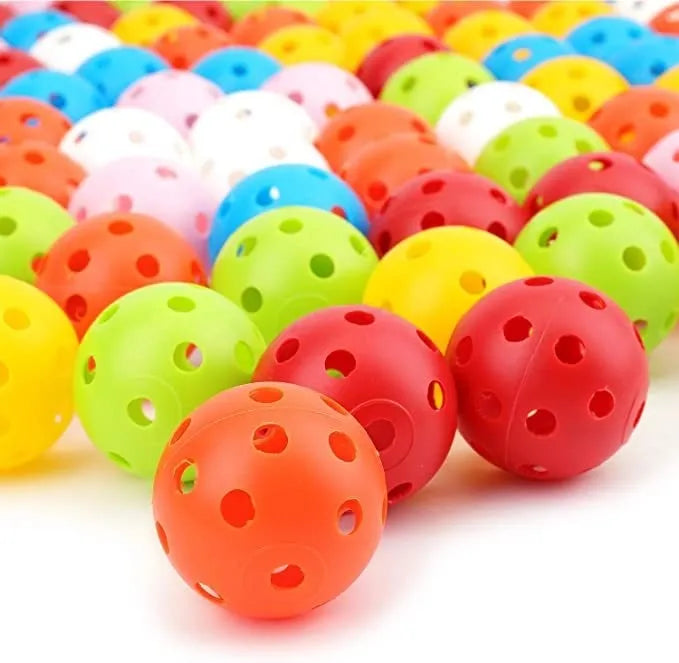 Multi-colour golf practice balls in red, orange, blue, green, white, and yellow packed in a net bag.