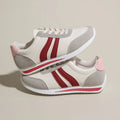 Red and blue lace-up running sneakers with mesh upper and flat rubber soles