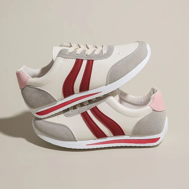 Red and blue lace-up running sneakers with mesh upper and flat rubber soles