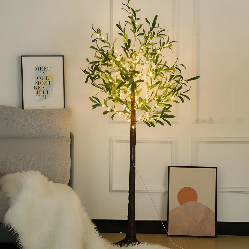 1.8 metre tall artificial olive leaf tree with warm white LED lights illuminated in a garden setting.