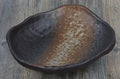 Japanese-style ceramic sashimi bowl with irregular shape and floral decoration