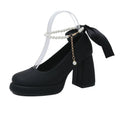 Beige women's Mary Jane shoes with a chunky heel and an ankle-strap buckle on a round toe.
