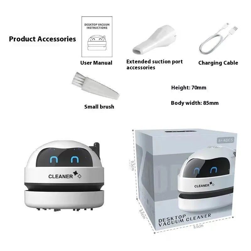 Handheld USB desktop vacuum cleaner in blue rocket design on a wooden desk next to a keyboard.
