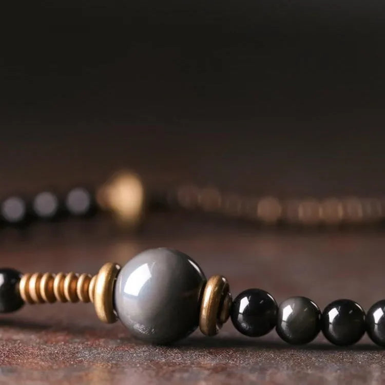 Black geometric layered beaded bracelet with adjustable sizing for unisex wear