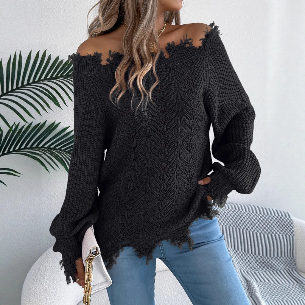 White hollow-out design off-the-shoulder long sleeve acrylic pullover sweater on a hanger.