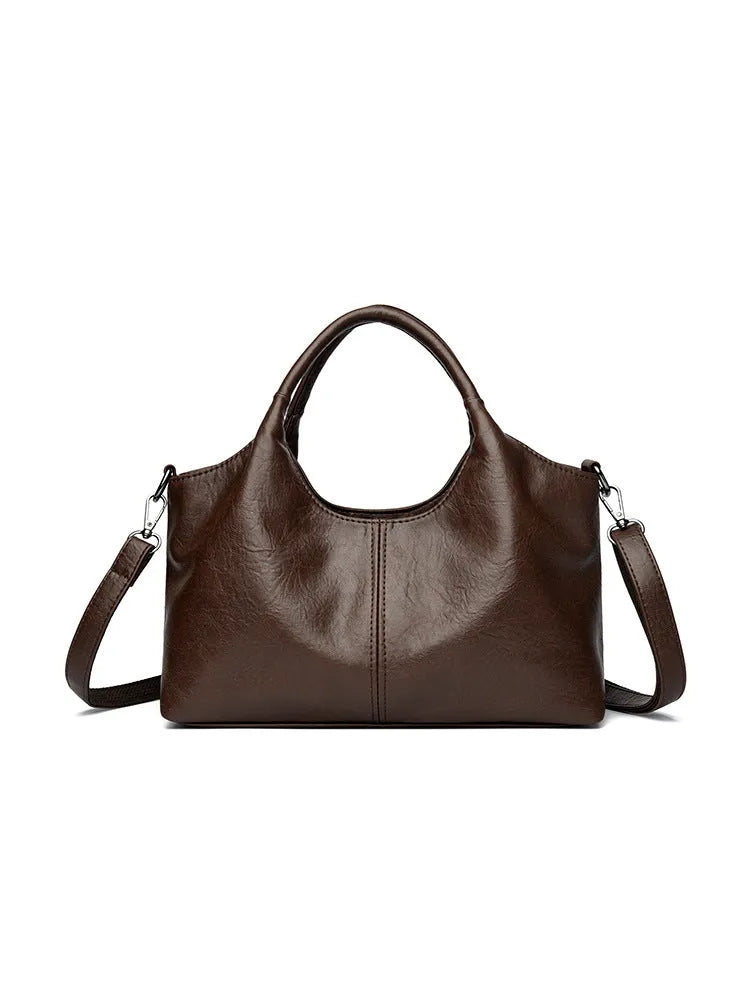 Women's soft genuine leather cross-body bag in one of seven colours with large capacity.