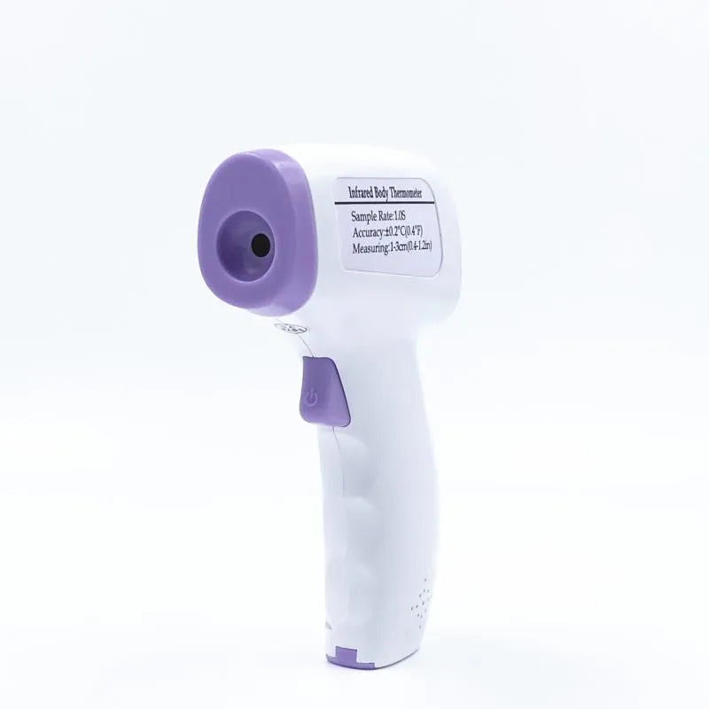 White digital thermometer for non-contact temperature measurement on a table.
