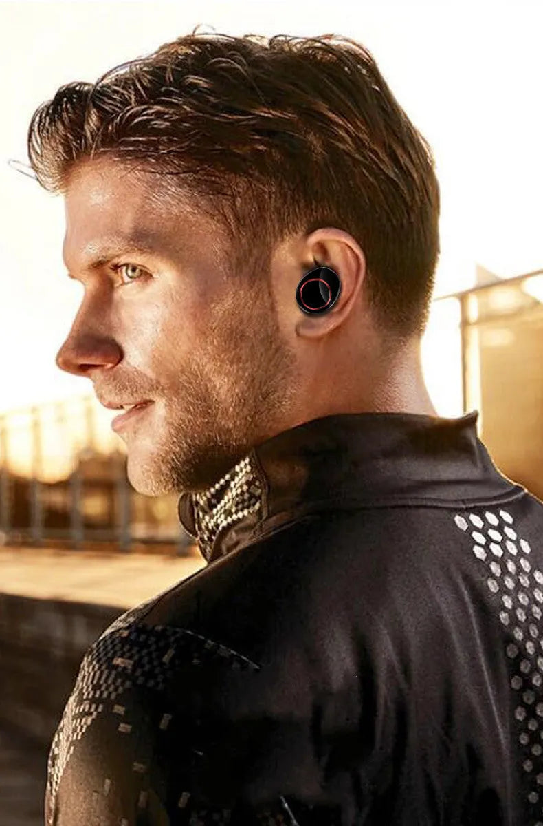 Black X11 wireless Bluetooth earbuds with charging case and six silicone ear tips on a grey background.