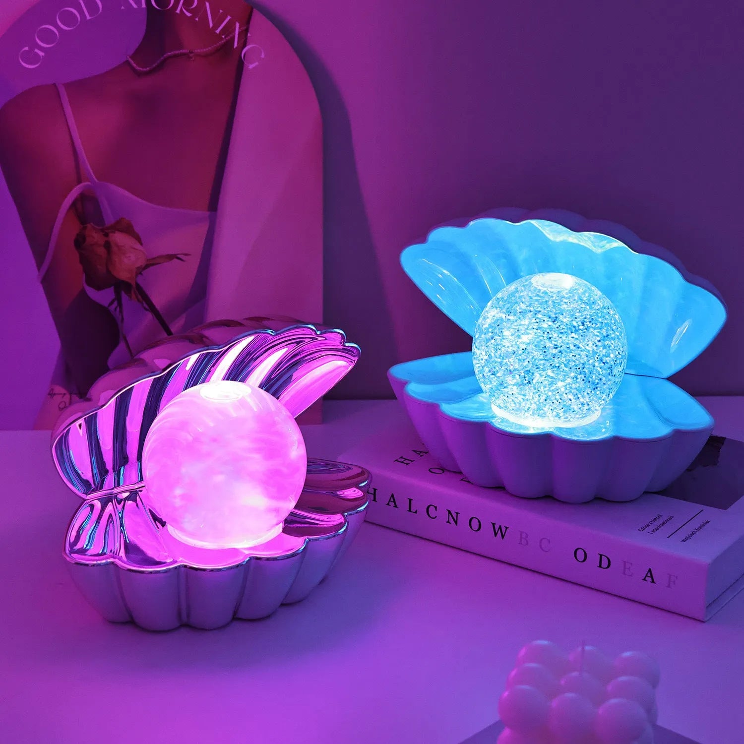 Shell-shaped small night lamp with neon ambience lighting on a table.