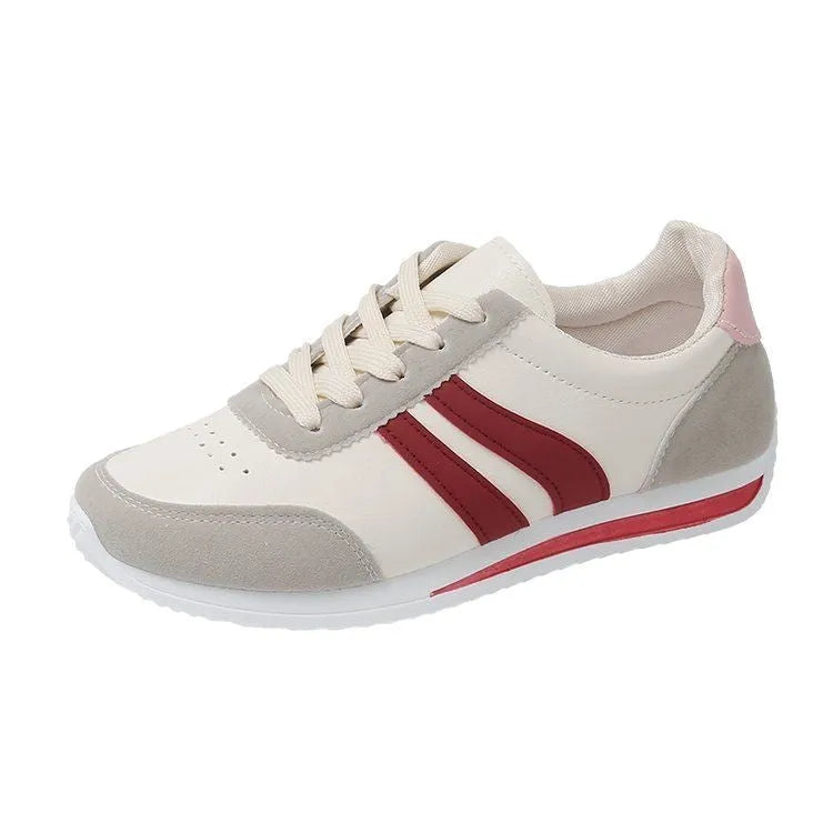 Red and blue lace-up running sneakers with mesh upper and flat rubber soles