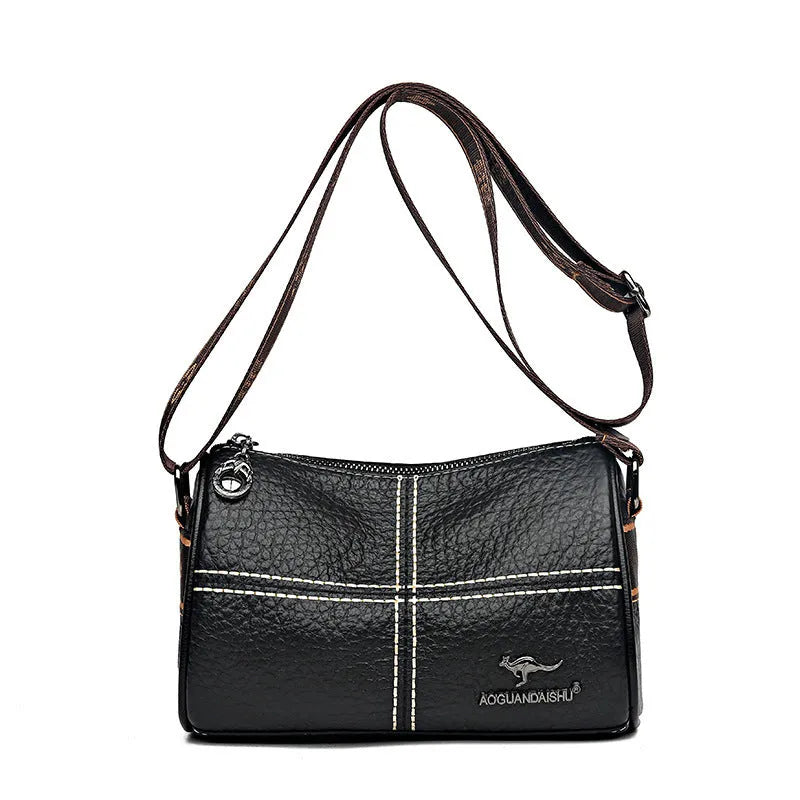 Casual genuine leather cylindrical shoulder bag for women in black, top grain, patchwork, soft texture.