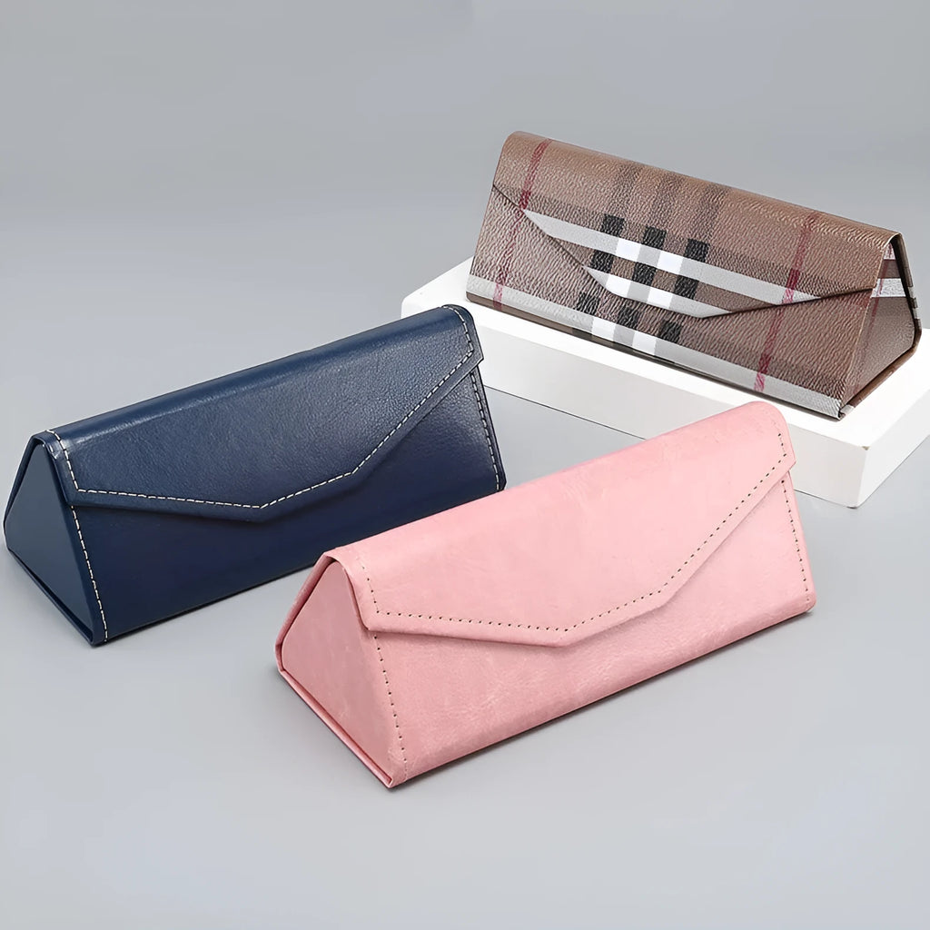 Handmade triangular folding glasses case in a PU cowhide pattern, shown closed and open next to a pair of full-rim frame glasses.