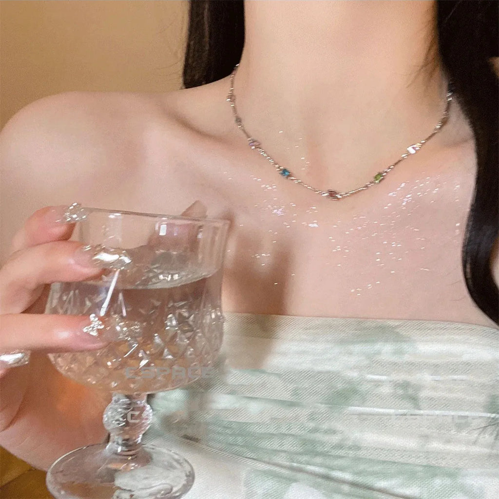 Square geometric artificial crystal pendant on clavicle-length alloy chain necklace in gold tone