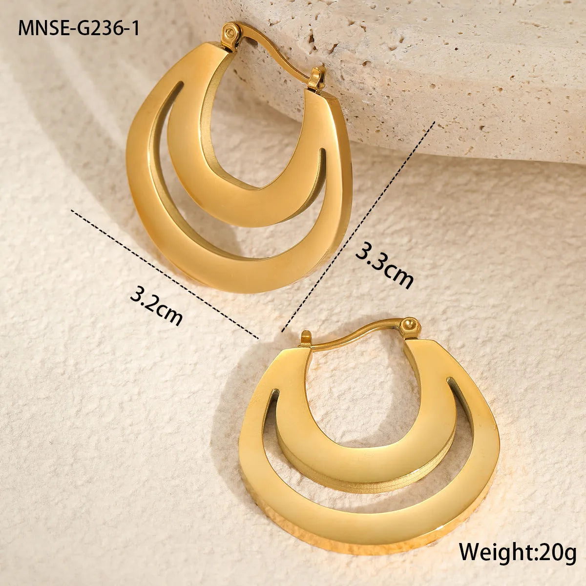 Geometric minimalist French earrings in gold and steel colours with round ring design elements