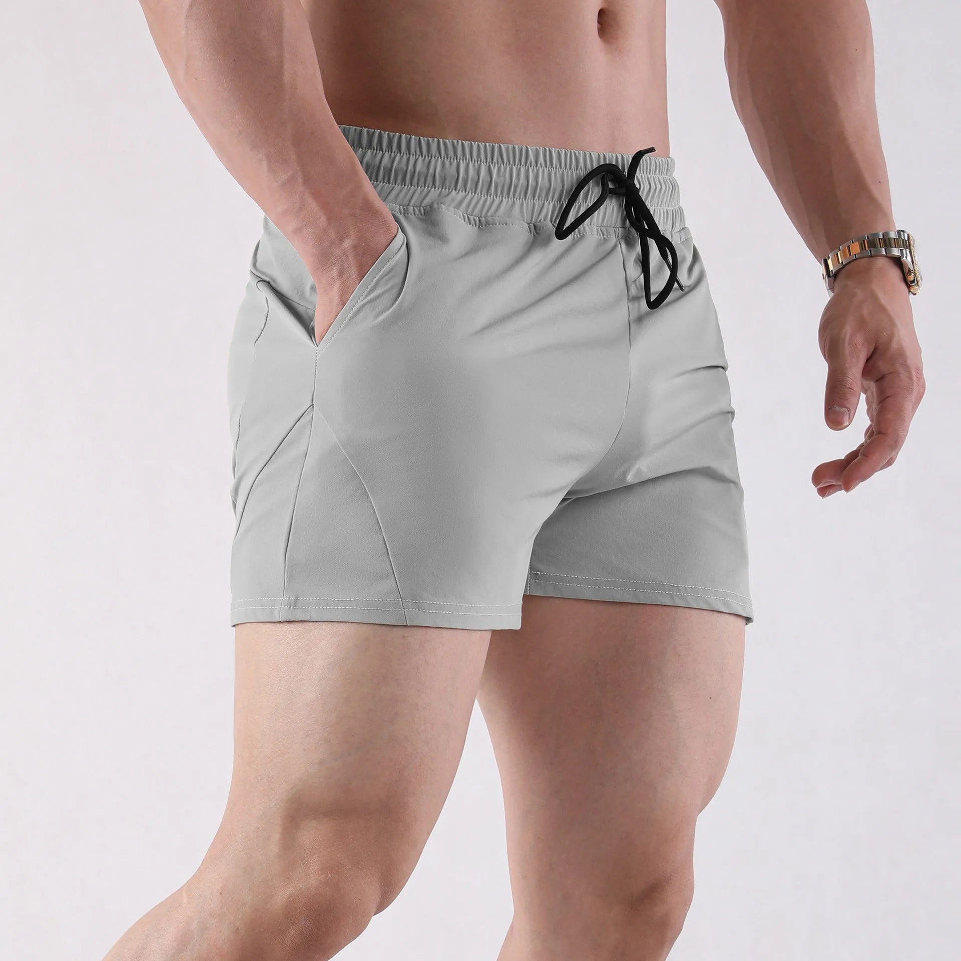 Thin polyester basketball shorts for men in grey, black, apricot and green colours with elastic waistband