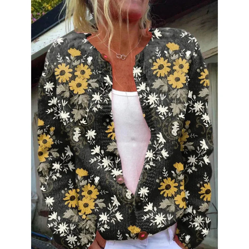 Yellow cardigan coat with a raised 3D pattern, shown on a hanger.