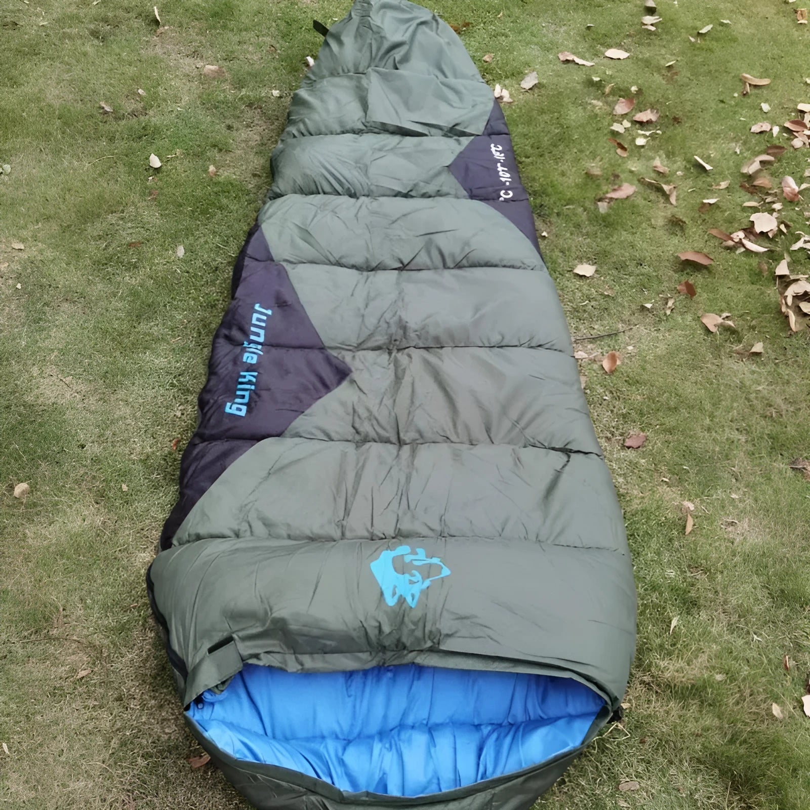 Cotton sleeping bag compressed in storage bag beside expanded sleeping bag showing 230cm length