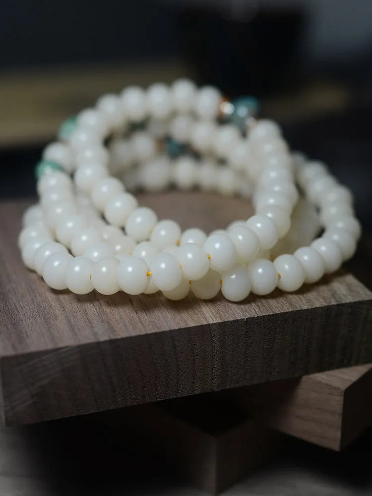 White bodhi seed bracelet with 108 flat round beads in two sizes