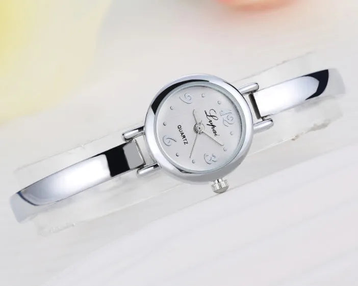 Women bracelet quartz wristwatch round dial silicone strap alloy case pin buckle silver rose gold