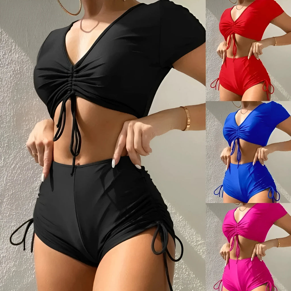 Women's dark green two-piece swimsuit with lace-up front and matching shorts.