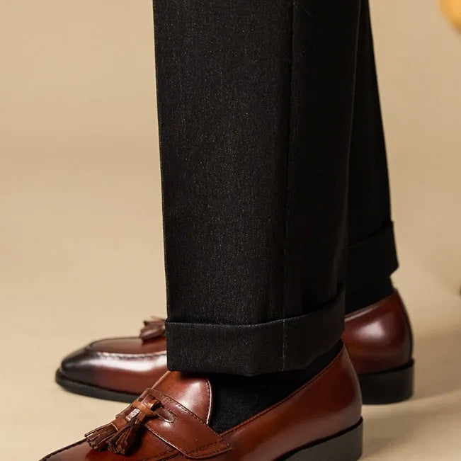 Men's black and brown polished leather tassel loafers with rubber sole