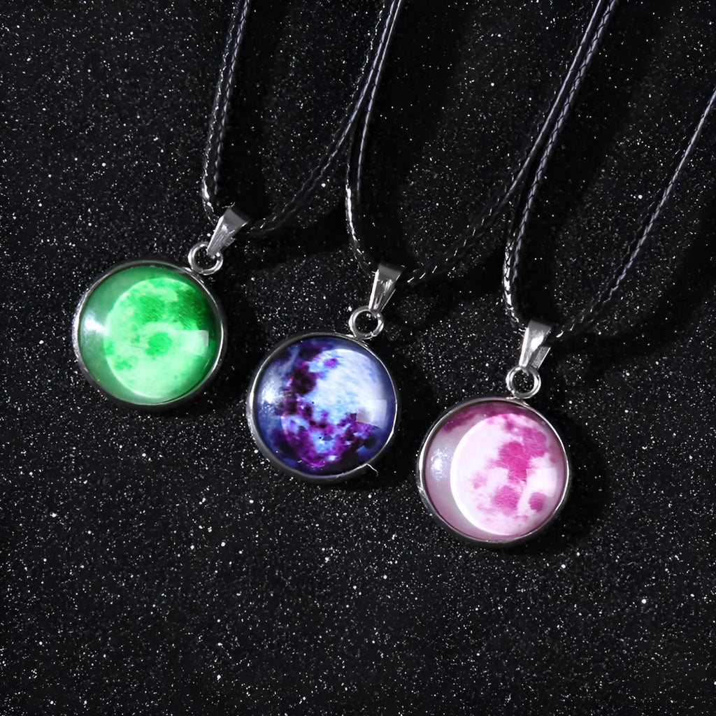 Luminous Christmas moon and night sky pendant necklace with adjustable chain on display