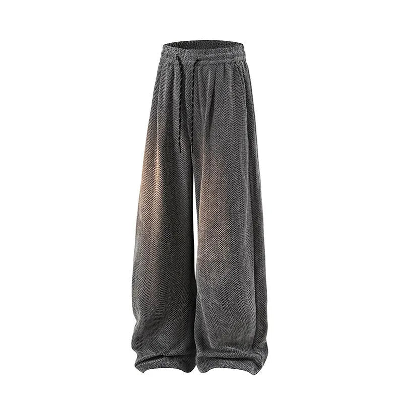 Man's straight-leg fleece-lined casual trousers in black, shown with elastic waistband detail.