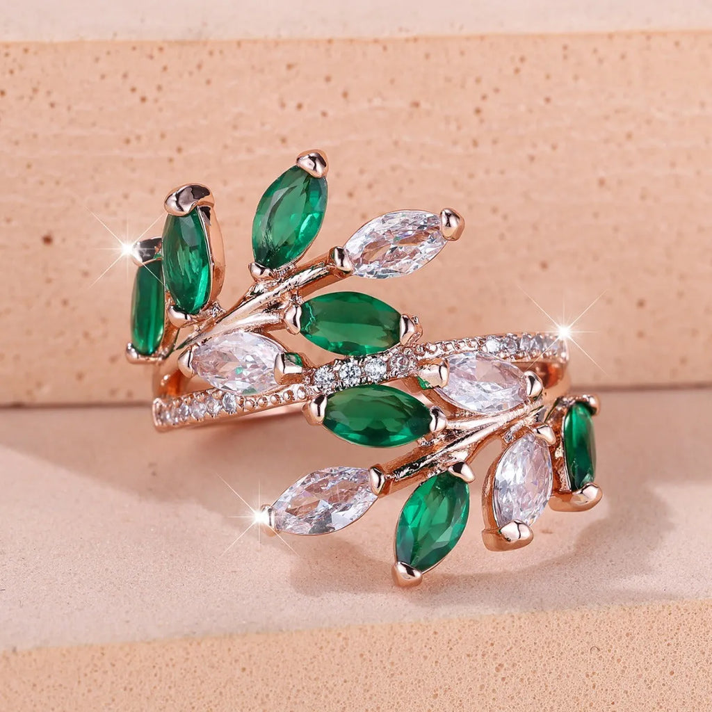 Copper leaf-shaped ring with adjustable band and central horse eye zircon stone in a choice of colours.