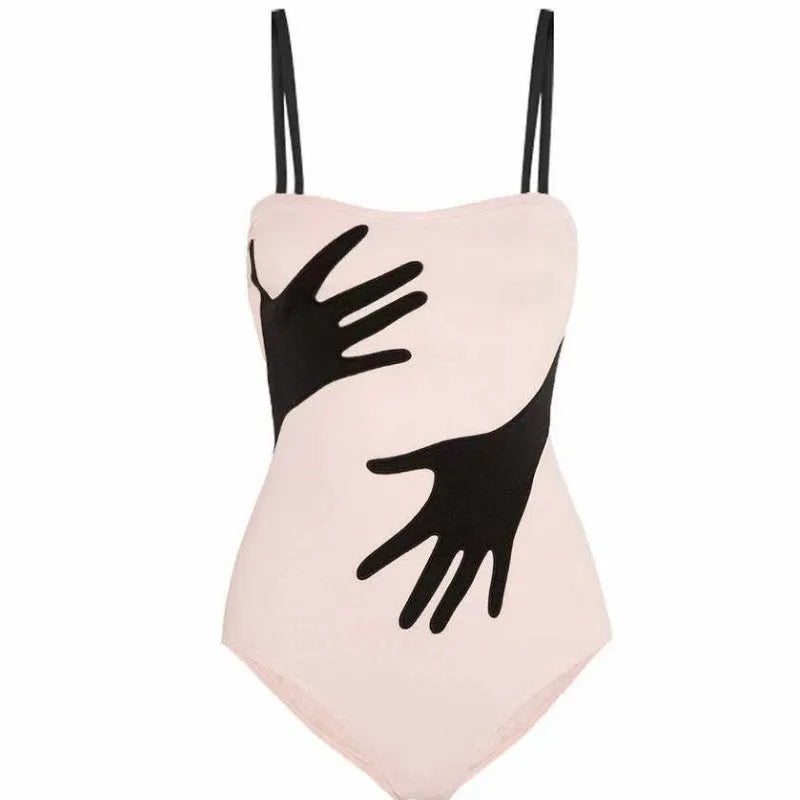 Women's one-piece bikini swimsuit with a gauze skirt attached, shown on a model.